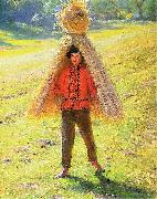 A boy carrying a sheaf